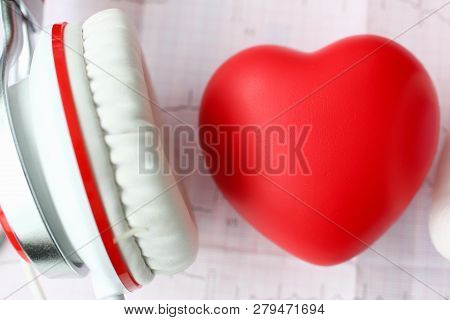 Red Toy Heart An Heaphones On Paper Cardiogram Background Closeup Concept