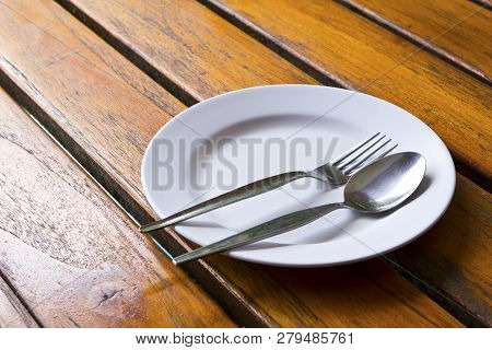 Closeup Of Plate On Old White Wood Table