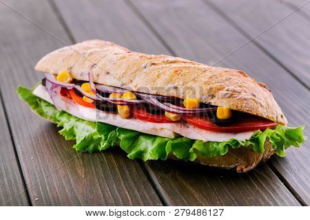 Delicious Sandwich With Blue Onion, Corn And Meat