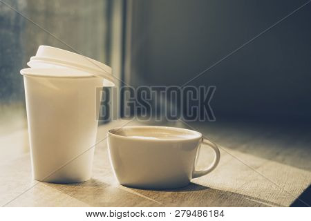 Coffee In Ceramic Cup And In Paper Cup To Go On Table In Cafe. Horizontal Toning