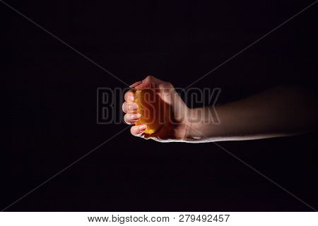 Image Of Woman Squeezes Juice From An Orange