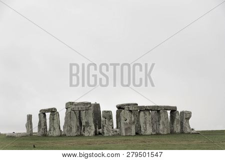 Amesbury, Great Britain - Dec 23, 2018: The Stone Monument Stonehenge A Cloudy Day, Built In The Lat