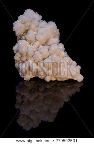 Natural Druse Of White Calcite On A Black Background With Reflection