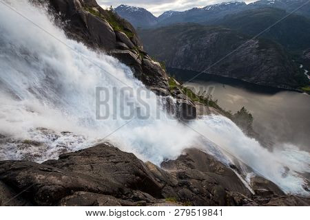 Summer Mountain Langfossen Waterfall On Slope Etne, Norway.