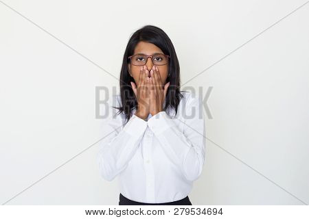 Shocked Girl Getting Disbelieving News. Young Indian Woman Covering Mouth With Both Hands. Female Of