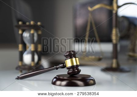 Lawyers Office. Gavel, Scale And Computer On The White Table.