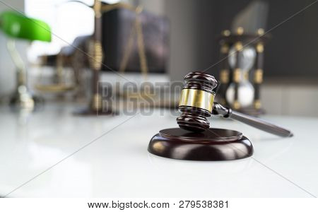 Lawyers Office. Gavel, Scale And Computer On The White Table.