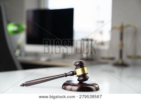 Lawyers Office. Gavel And Computer On The White Table.