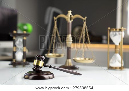 Lawyers Office. Gavel And Scale  On The White Table.