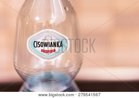 Poznan, Poland - November 17, 2018: Top Of A Polish Cisowianka Water Bottle In Soft Focus.