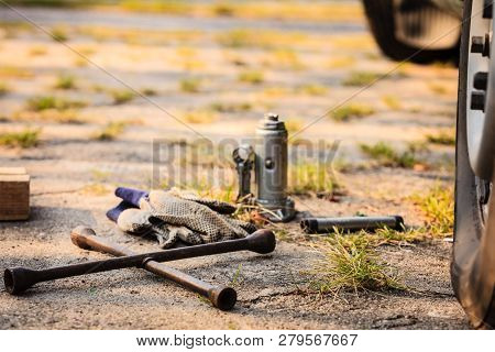 Socket Wheel Wrench And Jack Lying On Ground