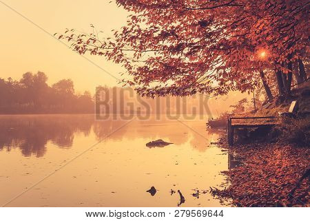 Photo Of A Pier On Autumn Calm Lake