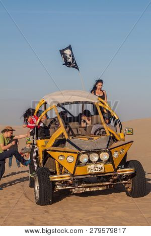 Huacachina, Peru - June 1, 2015: Tourists On Sand Dune Buggy Trip To The Dunes In Huacachina Desert,