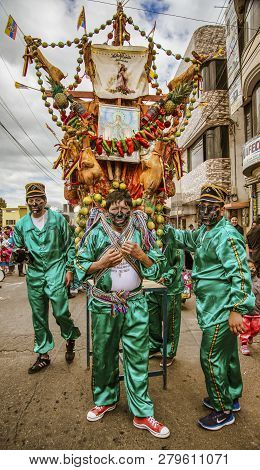 Latacunga, Ecuador - September 22, 2018 - The Strongest Men Of Each Neighborhood Carries A Pig And A