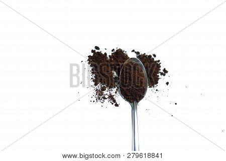 Instant Coffee Powder On A Stainless Spoon And The Ground On White Isolated Background