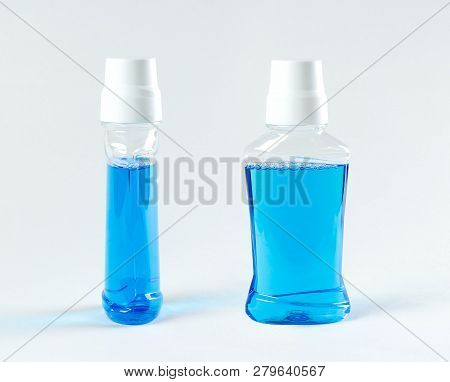 Blue Rinse For The Mouth. Close Up. Isolated On White Background.