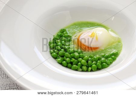 tear peas with poached egg, spanish basque cuisine