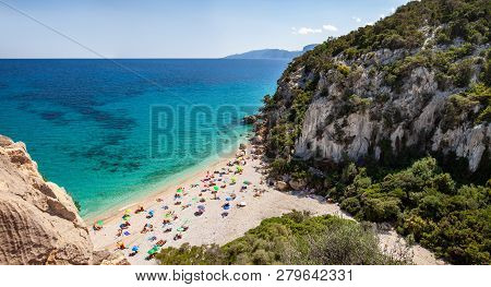 Top View Of Beautiful Sandy Beach Cala Fuili With Clear Sea Water In Sardinia, Italy