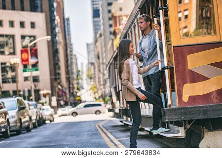 San Francisco cable car tram people tourists taking the popular tourist attraction tramway of the Powel-Hyde California, USA travel.