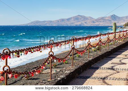 Puerto Del Carmen Beach In Lanzarote, Canary Islands, Spain, Heart Shaped Padlocks, Blue Sea, Palm T