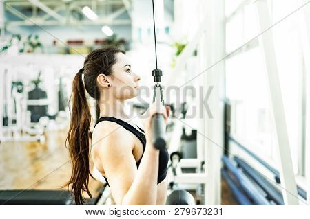 Young Women Doing Pulldown Exercise