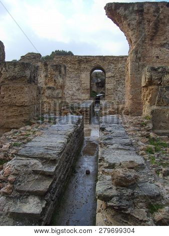Carthage, Tunisia - April 12, 2018: Ruins Of Bathhouse Of Carthage And View To Mediterranean Sea, Tu