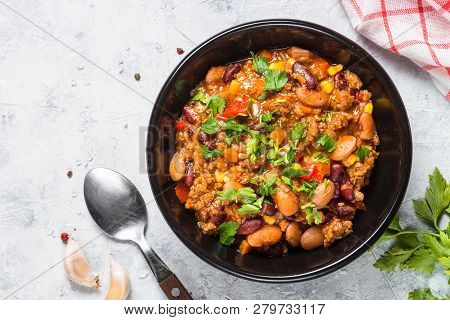 Chili Con Carne From Meat, Beans And Vegetables In Black Plate On Stone Table. Traditional Mexican F