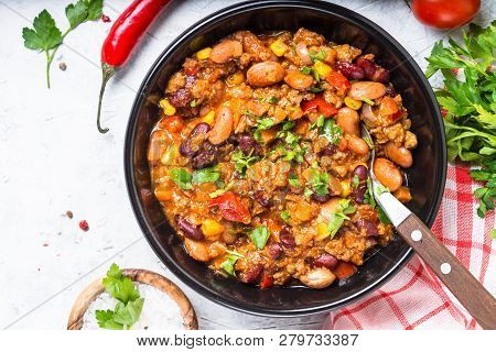 Chili Con Carne From Meat, Beans And Vegetables In Black Plate On Stone Table. Traditional Mexican F