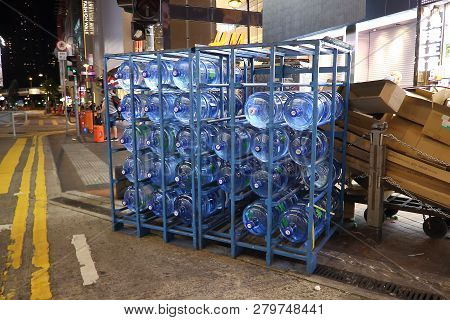 Hong Kong, China - October 4, 2018: Large Stacks Of Five-gallon Blue Plastic Water Carboys On Sidewa