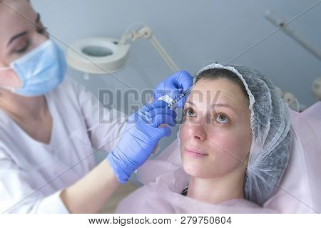 Contour Plastic Face. Rejuvenating Facial Injections Procedure For Tightening And Smoothing Wrinkles
