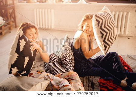 Pillow Fight At Dawn In Morning After Waking Up. Beautiful Kinky Girls Were Having Slumber Party