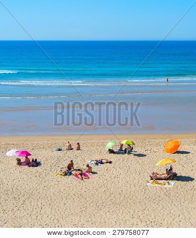 Odeceixe, Portugal - October 04, 2018: People At  Ocean Beach In A Summer Sunny Day. Odeceixe, Portu