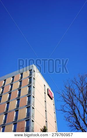 Poznan, Poland - October 31, 2018: Top Of A Mercure Hotel Building With Sign And Tree.