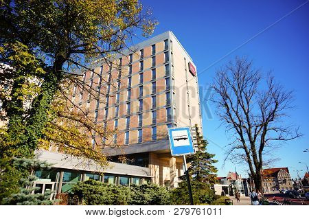Poznan, Poland - October 31, 2018: High Mercure Hotel Building On The Roosevelta Street. Tree And Bu