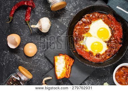 Shakshuka, Fried Eggs In Tomato Sauce In Iron Frying Pan. Typical Israel Food.
