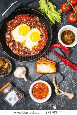 Shakshuka, Fried Eggs In Tomato Sauce In Iron Frying Pan. Typical Israel Food.