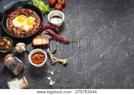 Shakshuka, Fried Eggs In Tomato Sauce In Iron Frying Pan. Typical Israel Food.