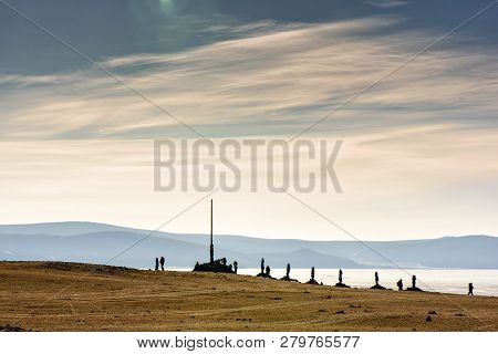 Sacred Place With Obo. Winter Landscape Of Mongolia. Lake Khubsugul And Mountain