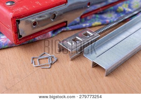 Tacker And Staples Used To Upholster Furniture. Accessories For Employees In The Carpentry Shop.