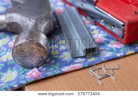 Tacker And Staples Used To Upholster Furniture. Accessories For Employees In The Carpentry Shop.