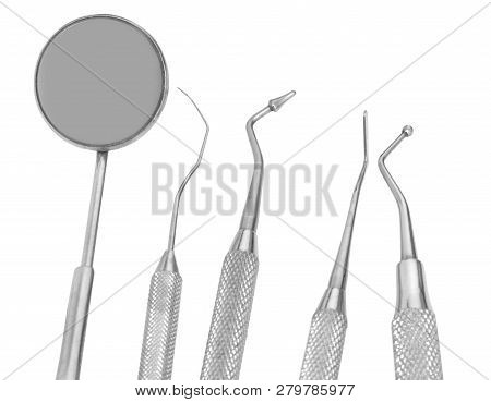Small Mirror And Dental Tool To Remove Tartar And More Tools In The Dental Office
