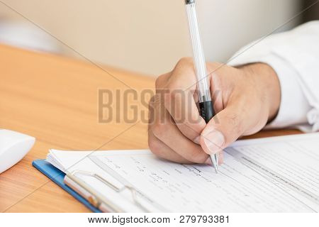 Healthcare Medical Expenses Concept, Hands Doctor's Writing And Working On Prescription Clipboard Wi