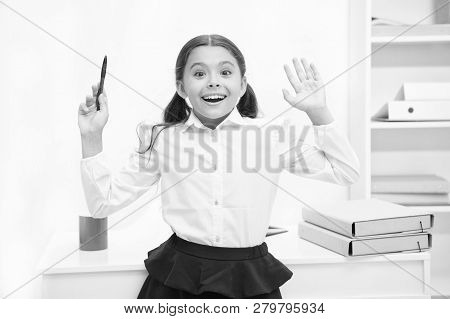 She Knows Right Answer. Child Girl Wears School Uniform Standing Excited Face Expression. Schoolgirl