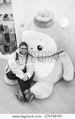 Reykjavik, Iceland - October 12, 2017: Man Traveler With Hello Kitty Toy. Leisure Traveler Man. Hell