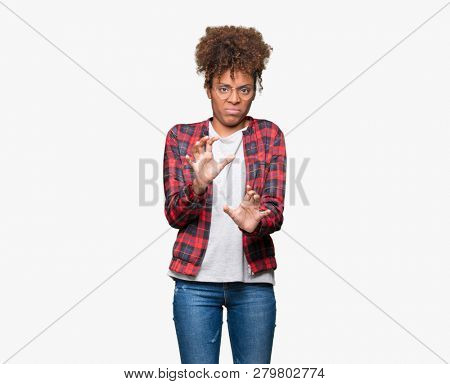 Beautiful young african american woman wearing glasses over isolated background disgusted expression, displeased and fearful doing disgust face because aversion reaction. With hands raised. Annoying 