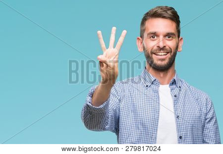 Young handsome man wearing white t-shirt over isolated background showing and pointing up with fingers number three while smiling confident and happy.