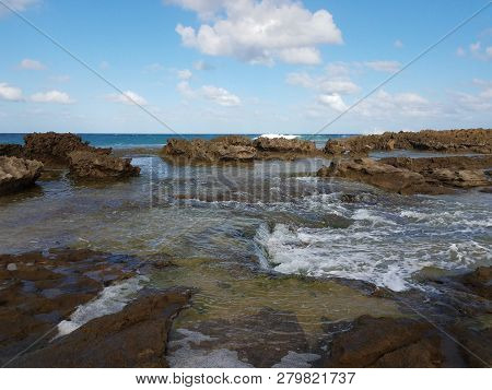 Rocky Shore At Beach With Tidepools In Isabela, Puerto Rico