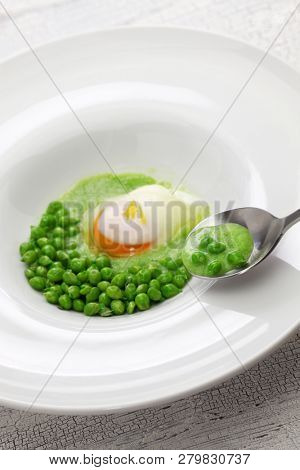 tear peas with poached egg, spanish basque cuisine