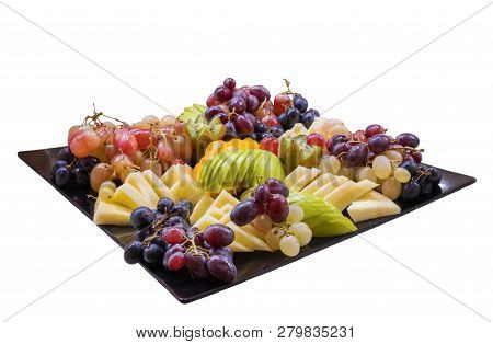 Sliced Mixed Fruit On The White Plate, White Background Isolated