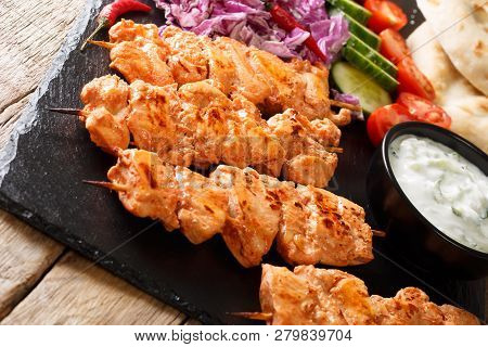 Lebanese Shish Taouk (tawook)with Fresh Vegetables, Yogurt Sauce And Pita Close-up. Horizontal